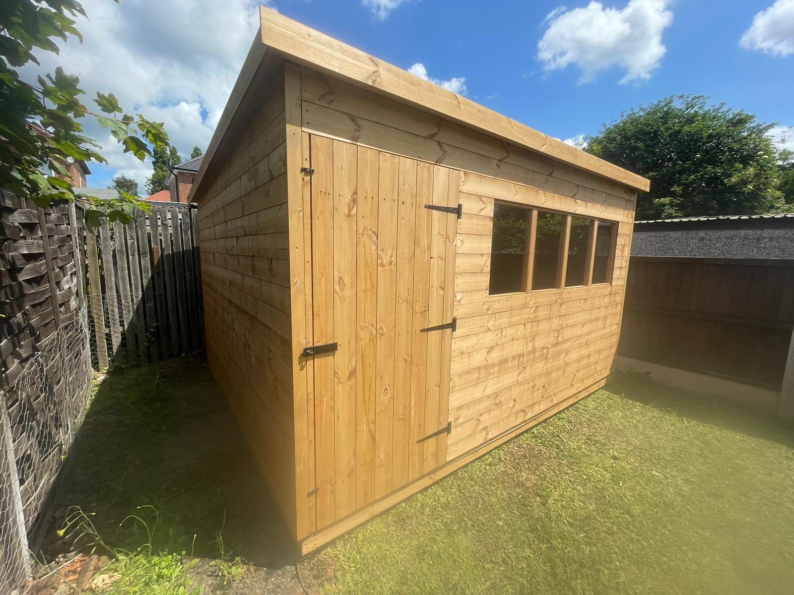 Pent timber shed with windows
